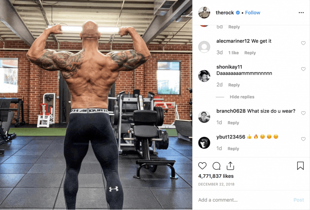 The Rock flexing at the gym