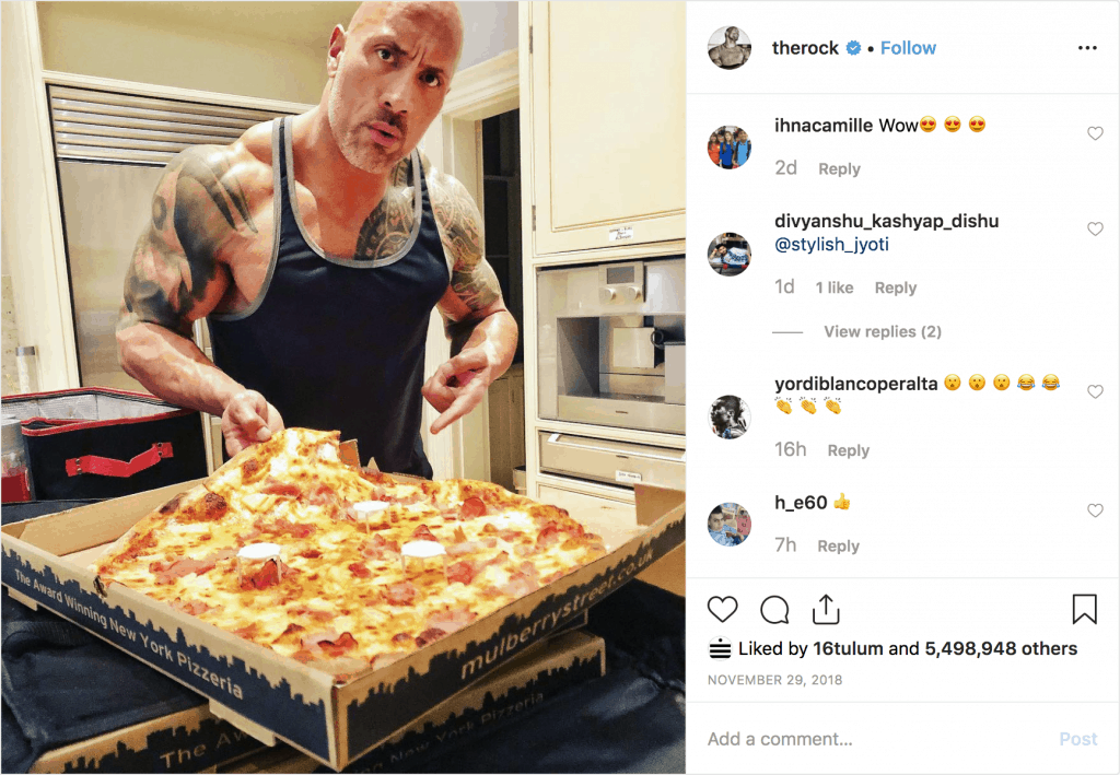 The Rock eating a whole pizza